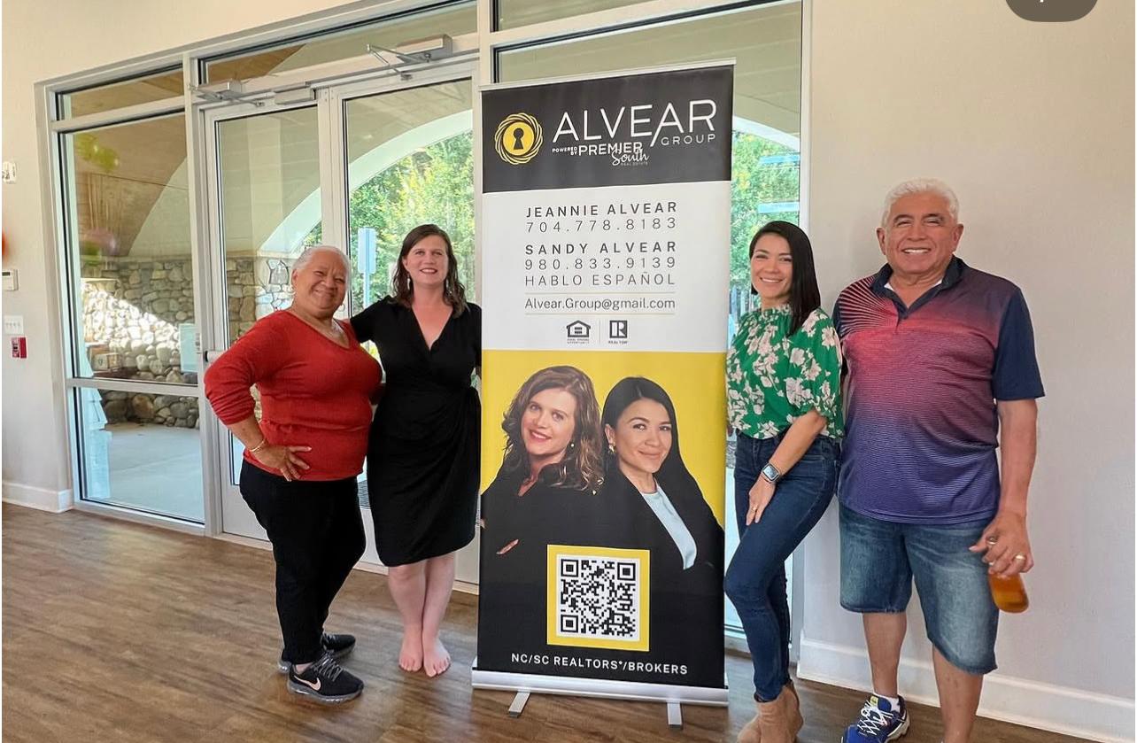 Alvear Group banner at community event in Belmont NC