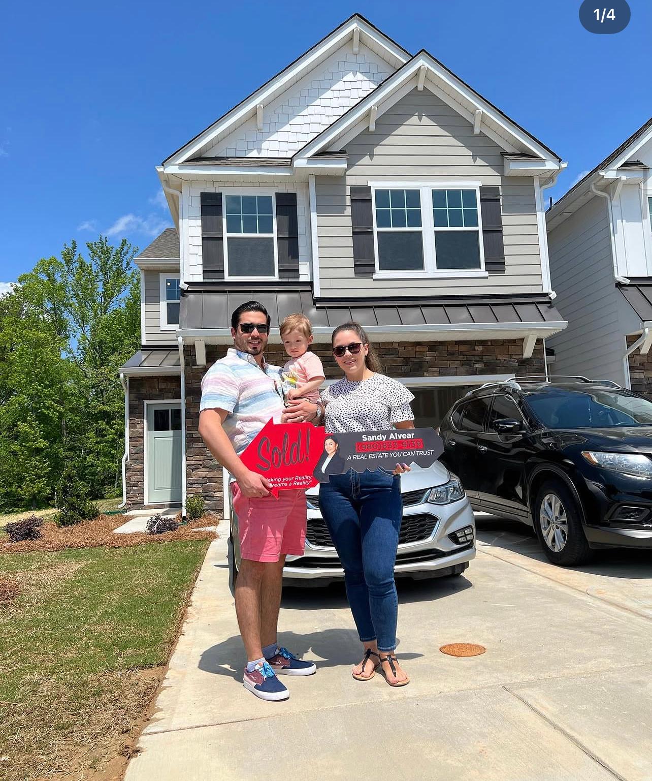 Family celebrates new home purchase — Sandy Alvear Group NC