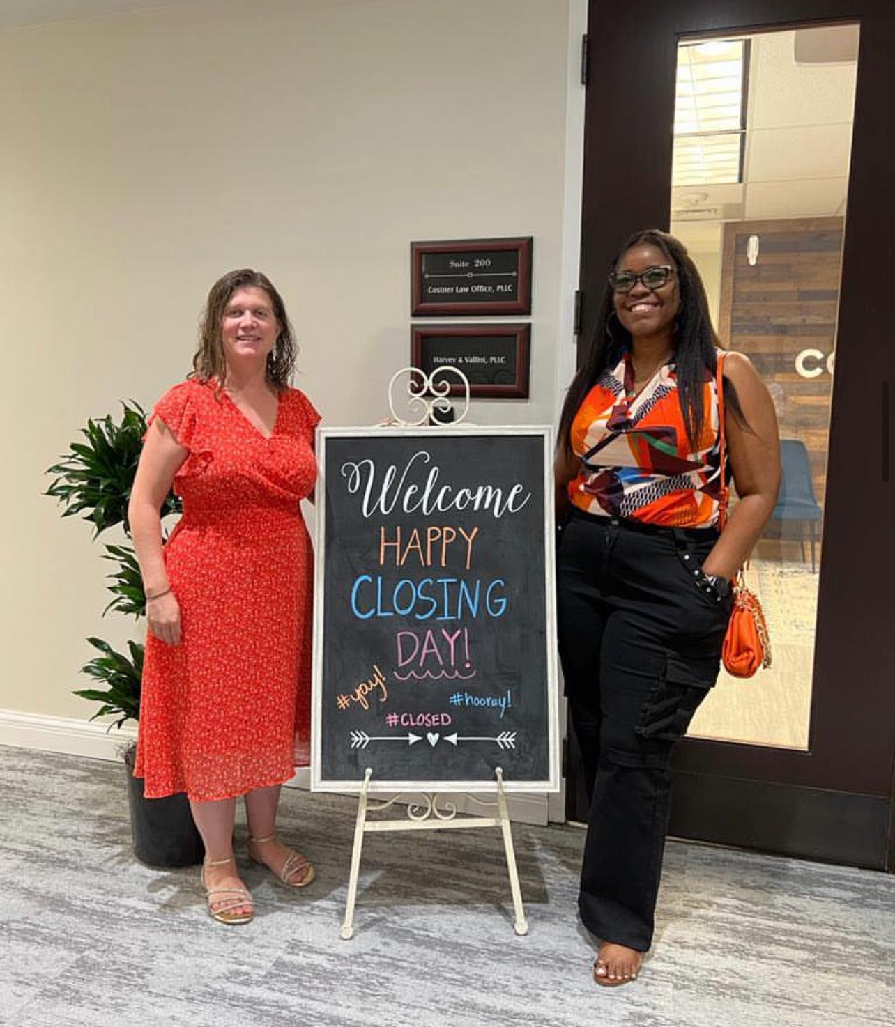 Happy Closing Day — Jeannie Alvear with client at law office