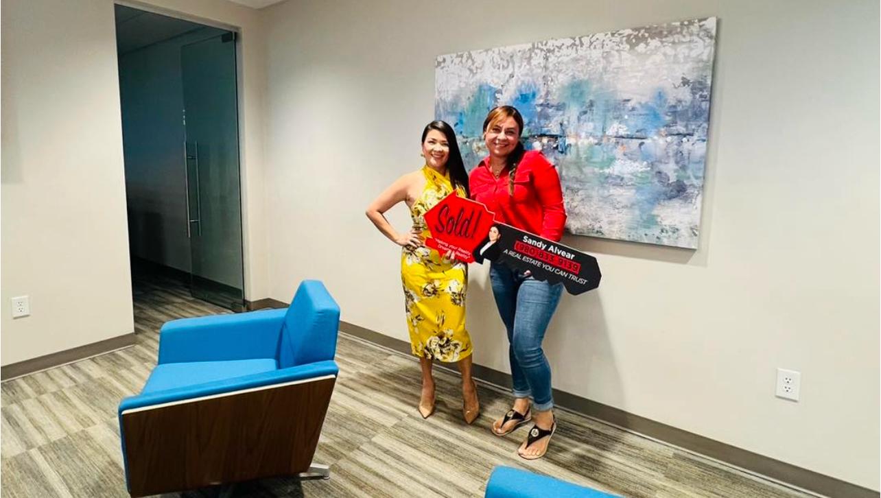 Sandy Alvear with client on closing day