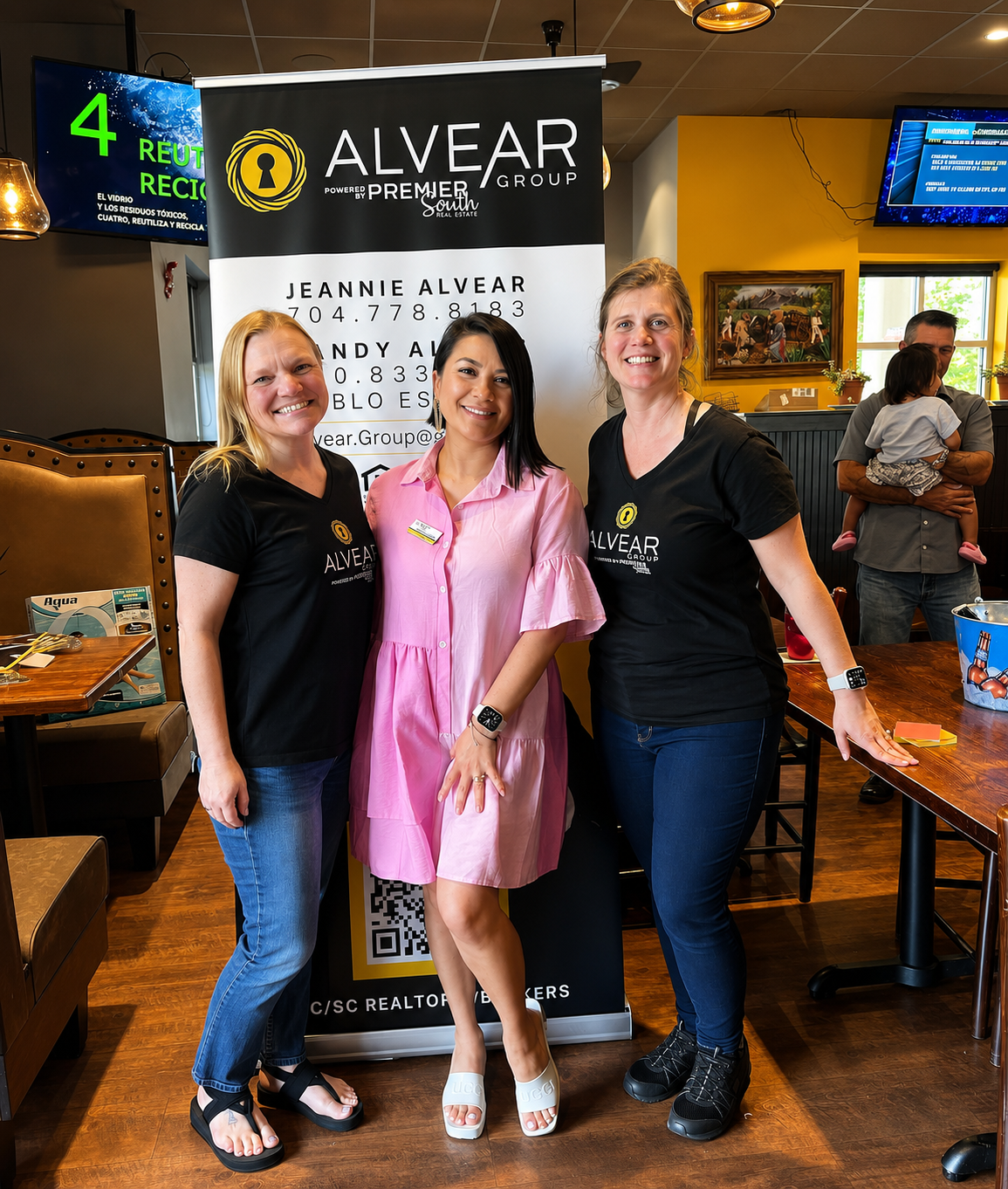 Sandy Alvear and clients at Alvear Group community event