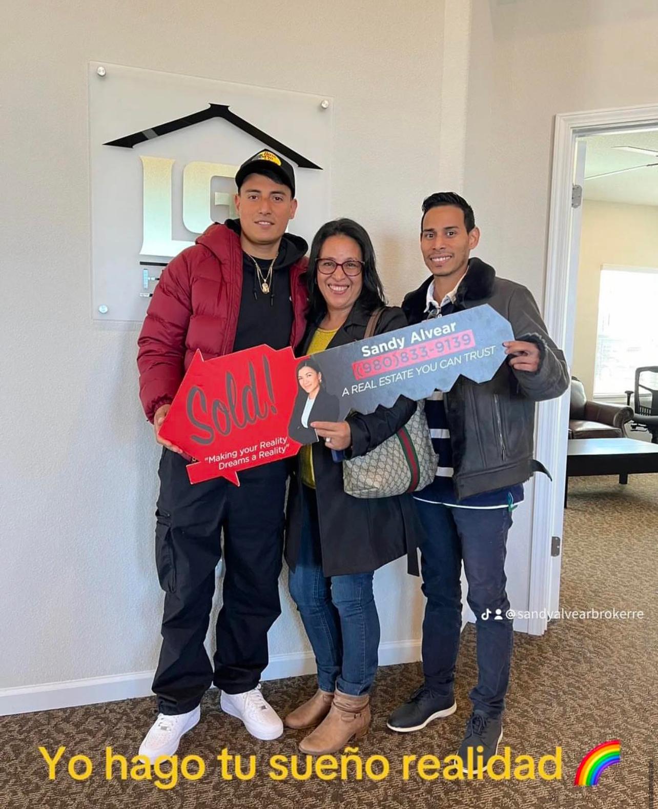 Sandy Alvear with clients at LGI Homes closing table